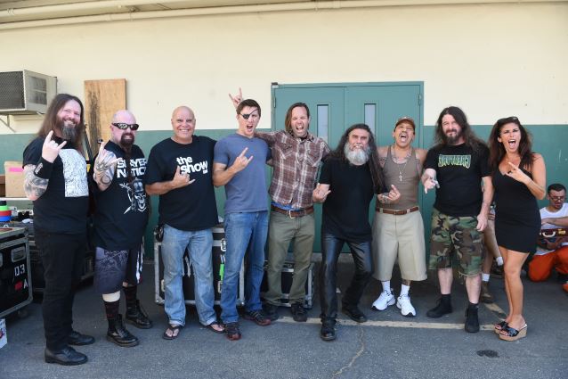 Slayer shot the music video for the new track "Repentless" on August 26, 2015 at the Sybil Brand Institute in Los Angeles.  The band joined some of the cast and crew for this photo. LEFT TO RIGHT:  Slayer's Gary Holt and Kerry King; actors Tony Moran and Jason Trost, video director BJ McDonnell, Slayer's Tom Araya, actor Danny Trejo, Slayer's Paul Bostaph, video producer Felissa Rose. At the music video shoot for Slayer's new track "Repentless," the band is